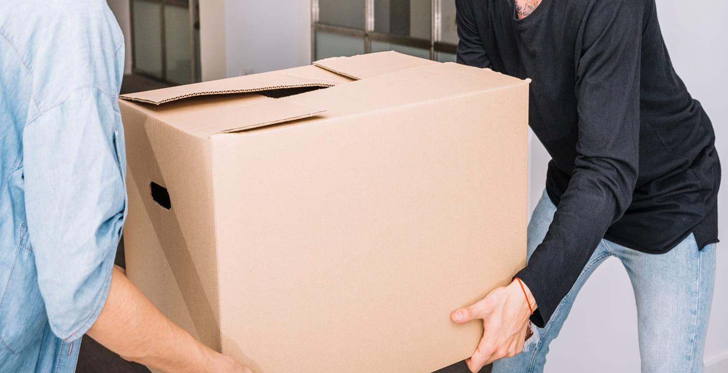 Two people carrying large package for parcel delivery service Australia